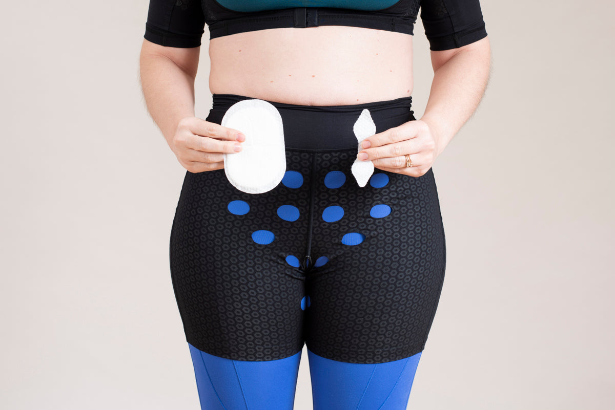 Woman wearing HidraWear Briefs For Women holding a HidraWear Dressing in each hand