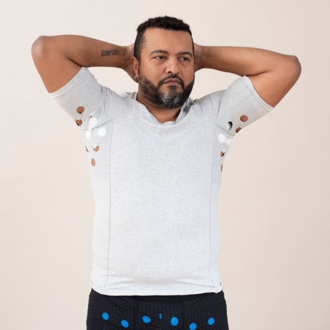 Man wearing HidraWear AX T-shirt with arms raised to show the underarm area