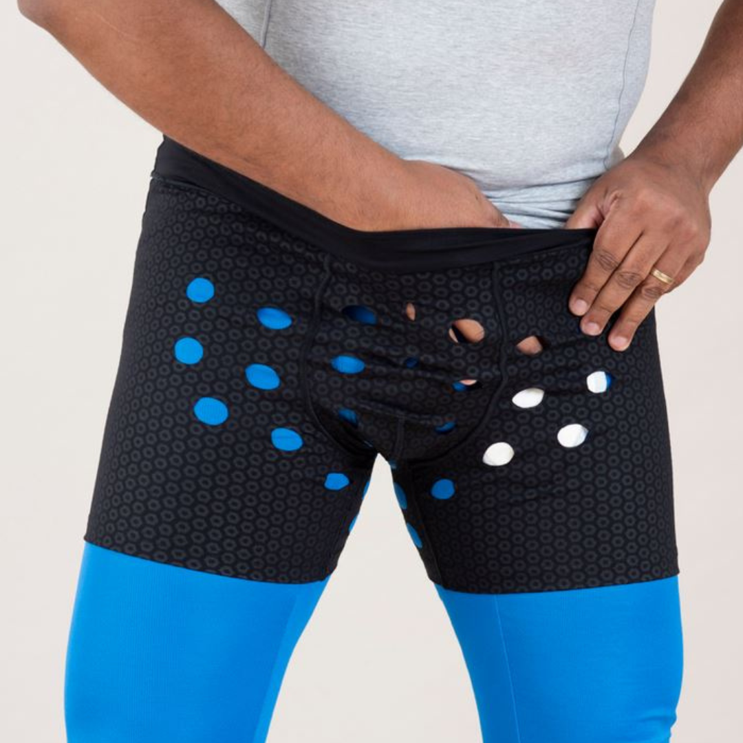 Man wearing HidraWear Boxer Briefs For Men shown placing the HidraWear Dressing into place at the front of the garment