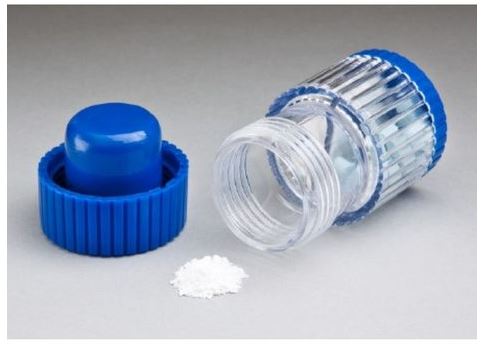 Clear plastic bottle with blue top and bottom caps.