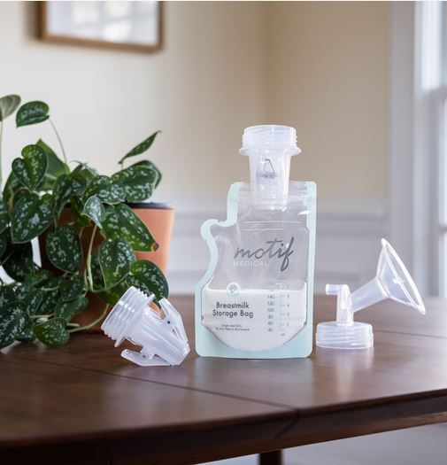 Motif Medical Pump-To-Bag Adapter showing the adapter clipped to a Motif Medical Breastmilk Storage Bag to show how it works