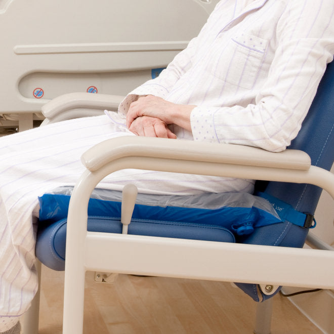 Patient Seated In Hospital Setting On Inflated Repose Seat Cushion