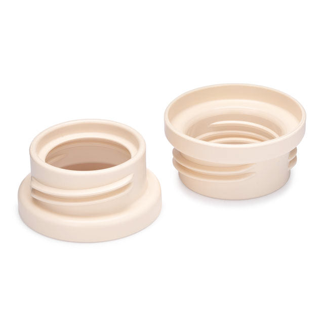 Motif Medical Wider Bottle Adapter white background with cream adapters