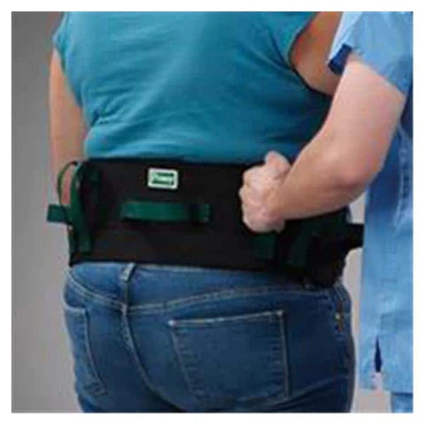 A patient is being aided by a caregiver using the handles on the transfer belt, gait belt