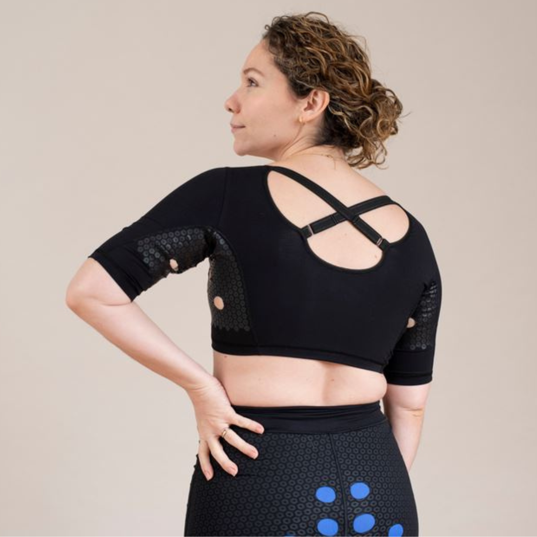 Woman wearing the HidraWear AX Crop Top view from the back - cross cross straps