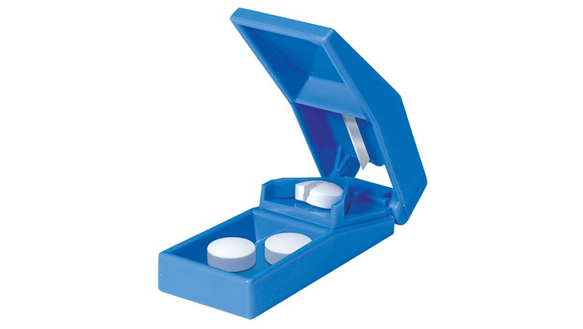 Blue pill splitter shown with white tablets